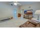 Spacious living room with hardwood floors and large TV at 419 Ramblewood St, Port Charlotte, FL 33953