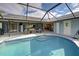 Enjoy this relaxing pool area with covered patio at 419 Ramblewood St, Port Charlotte, FL 33953