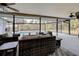 Covered patio overlooks a refreshing pool at 419 Ramblewood St, Port Charlotte, FL 33953