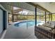 Covered patio with pool and access to the house at 419 Ramblewood St, Port Charlotte, FL 33953