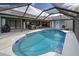 Inviting pool with covered patio and seating area at 419 Ramblewood St, Port Charlotte, FL 33953