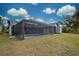 Screened-in pool and patio area at 419 Ramblewood St, Port Charlotte, FL 33953