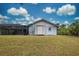 Detached storage shed in the backyard at 419 Ramblewood St, Port Charlotte, FL 33953
