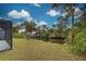 Private dock on a tranquil canal with lush greenery at 419 Ramblewood St, Port Charlotte, FL 33953