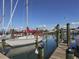 Sailboats docked at a marina with a wooden walkway at 432 Sunset Lake Blvd # 201, Venice, FL 34292