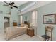 Bright and airy main bedroom with high ceilings and ensuite bathroom access at 5039 Bella Terra Dr, Venice, FL 34293