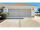 Garage with screen door and white door at 5045 Pompano Rd, Venice, FL 34293