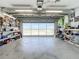 Large garage with storage and view of street at 5045 Pompano Rd, Venice, FL 34293