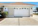 Garage with white door and decorative window at 5045 Pompano Rd, Venice, FL 34293