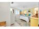 Bedroom with a white bed, yellow walls, and ceiling fan at 555 Circlewood Dr # T10, Venice, FL 34293