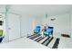 Bright carport with seating area and bicycle storage at 555 Circlewood Dr # T10, Venice, FL 34293