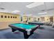 Clubhouse recreation room with pool table at 555 Circlewood Dr # T10, Venice, FL 34293