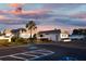 Community clubhouse with parking and landscaping at 555 Circlewood Dr # T10, Venice, FL 34293