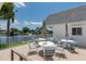 Community patio with lake view and seating at 555 Circlewood Dr # T10, Venice, FL 34293