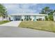 Cute and charming Florida home with teal door and carport at 555 Circlewood Dr # T10, Venice, FL 34293