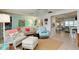 Bright living room with coastal decor and open floor plan at 555 Circlewood Dr # T10, Venice, FL 34293