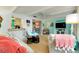 Bright living room with light colored furniture and TV at 555 Circlewood Dr # T10, Venice, FL 34293