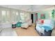Living room with large windows and coastal decor at 555 Circlewood Dr # T10, Venice, FL 34293
