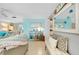 Living area with coastal decor and comfy seating at 555 Circlewood Dr # T10, Venice, FL 34293