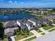 Aerial view of a house and neighborhood near a lake at 5930 Anise Dr, Sarasota, FL 34238