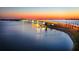 Aerial view of a bridge at sunset, with water and city lights reflecting at 5930 Anise Dr, Sarasota, FL 34238