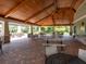 Covered pavilion with tables and chairs, overlooking a resort-style pool at 5930 Anise Dr, Sarasota, FL 34238