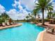 Relaxing pool area with lounge chairs and umbrellas at 5930 Anise Dr, Sarasota, FL 34238