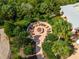 Aerial view of fire pit surrounded by seating in a landscaped courtyard at 5930 Anise Dr, Sarasota, FL 34238