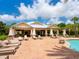 Community poolside pavilion with lounge chairs at 5930 Anise Dr, Sarasota, FL 34238