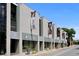 Modern building with various shops and businesses; located on a city street at 5930 Anise Dr, Sarasota, FL 34238