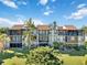 Aerial perspective of the building's exterior and landscaping at 612 Bird Bay S Dr # 309, Venice, FL 34285