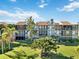 Aerial view of the community, showcasing the building and green space at 612 Bird Bay S Dr # 309, Venice, FL 34285