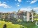 Aerial view of the building and surrounding landscape at 612 Bird Bay S Dr # 309, Venice, FL 34285