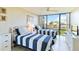 Bedroom with two twin beds and water view at 612 Bird Bay S Dr # 309, Venice, FL 34285