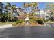 Cardinal building exterior showcasing landscaping and signage at 612 Bird Bay S Dr # 309, Venice, FL 34285
