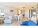 Living room with ample natural light, seating, and a dining area at 612 Bird Bay S Dr # 309, Venice, FL 34285