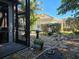 Landscaped backyard oasis with pathway and tropical plants at 624 Silk Oak Dr, Venice, FL 34293
