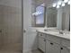 Main bathroom with walk-in shower and double vanity at 624 Silk Oak Dr, Venice, FL 34293