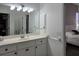 Bathroom with vanity, mirror and view of bedroom at 624 Silk Oak Dr, Venice, FL 34293