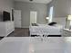 Bedroom with white dresser and ensuite bathroom at 624 Silk Oak Dr, Venice, FL 34293