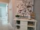 Entryway with decorative console table and art at 624 Silk Oak Dr, Venice, FL 34293