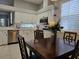 Spacious kitchen with white cabinets, stainless steel appliances, and quartz countertops at 624 Silk Oak Dr, Venice, FL 34293