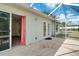 Screened-in back porch with access to yard at 6502 Whelan St, Englewood, FL 34224