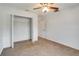 Bedroom with carpet, ceiling fan, and closet at 6502 Whelan St, Englewood, FL 34224
