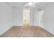 Spacious bedroom with plush carpeting and ceiling fan at 6502 Whelan St, Englewood, FL 34224