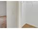 Bedroom closet with neutral carpet and white walls, featuring a wire shelf for organization at 6502 Whelan St, Englewood, FL 34224
