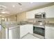 Bright kitchen with stainless steel appliances and granite countertops at 6502 Whelan St, Englewood, FL 34224