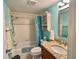 Clean bathroom with granite vanity and a shower/tub combo at 654 Bird Bay E Dr # 106, Venice, FL 34285