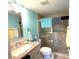 Bathroom with granite vanity and a walk-in shower at 654 Bird Bay E Dr # 106, Venice, FL 34285