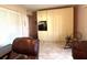Relaxing guest room with two leather recliners and built-in storage at 654 Bird Bay E Dr # 106, Venice, FL 34285